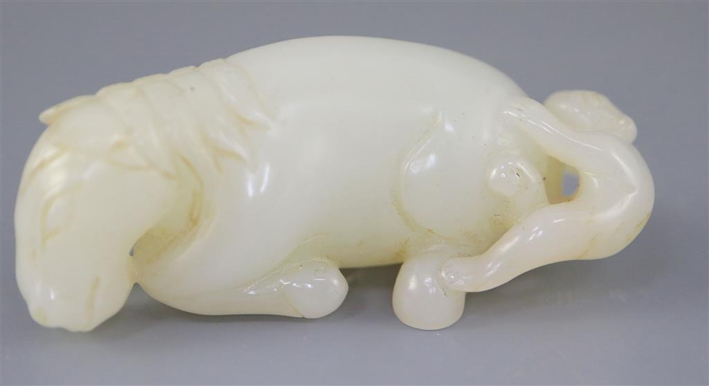 A Chinese white jade group of a recumbent horse and boy, 6cm long